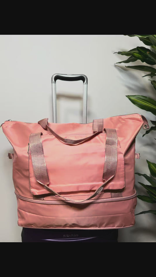 Video demostrativo bolso viaje rosa plegable con ruedas giratorias